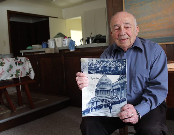 Marine veteran Theodore Heger is shown in his home Wednesday, Jan. 6, 2015, holding a program for the Marine Band, which he played oboe in for four years. Curtis Wildfong/Sentinel staff
