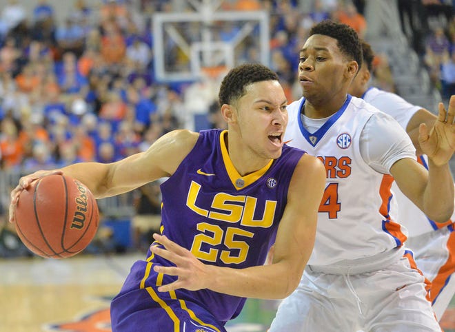 Ben Simmons (25) goes to the basket while Justin Leon (24) defends during the University of Florida's game against Louisiana State University at the Stephen C. O'Connell Center on Saturday. The Gators defeated the Tigers 68-62.