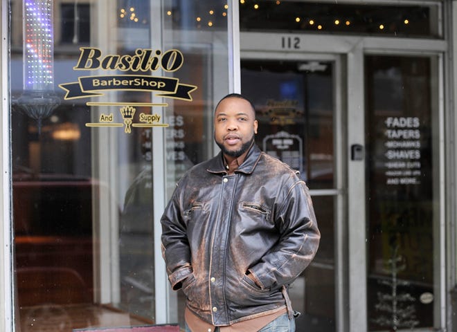 Basilio Barbershop owner Gerod Sturgis is seen outside his new shop in downtown Adrian.