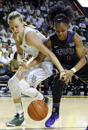 Baylor's Kristy Wallace (4) and TCU's Toree Thompson (1) reach for a loose ball during the second half of an NCAA college basketball game, Saturday, Jan. 9, 2016, in Waco, Texas. Baylor won 72-55. (AP Photo/Jerry Larson)