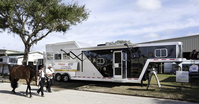 A specialized horse trailer is displayed in Tampa last month. The trailer has room for horses in the back and RV-like living quarters in the front complete with a fireplace, sleeping quarters, kitchen and pop-out seating area. JAMES BORCHUCK/TAMPA BAY TIMES