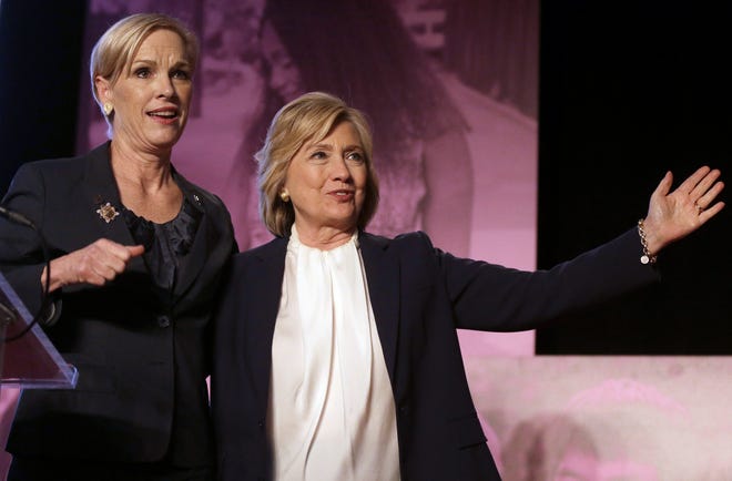 Democratic presidential candidate Hillary Clinton, right, stands with Cecile Richards, Planned Parenthood's president, during an event Sunday, Jan. 10, in Hooksett, during which Planned Parenthood endorsed Clinton in the presidential race. The endorsement by the group's political arm marks Planned Parenthood's first time wading into a presidential primary. (AP Photo/Steven Senne)