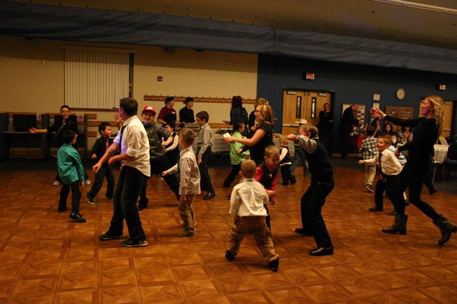 Guests at Mother/Son Formal Dance show off their moves to the song, "Watch Me (Whip/Nae Nae)" at Big Creek Rec Center Friday.