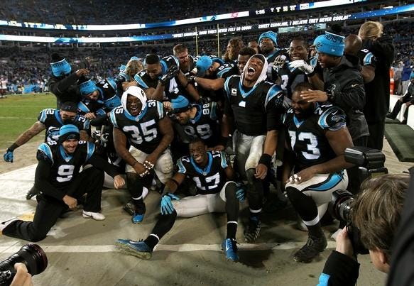 The Carolina Panthers celebrate their victory over the Tampa Bay Buccaneers on Sunday, Jan. 3 in Charlotte.