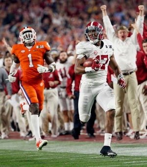 Alabama's Kenyan Drake, right, breaks away for a touchdown return against Clemson's Jayron Kearse (1) during the second half of the NCAA college football playoff championship game Monday, Jan. 11, 2016, in Glendale, Ariz. (Michael Chow/The Arizona Republic via AP) MARICOPA COUNTY OUT; MAGS OUT; NO SALES; MANDATORY CREDIT