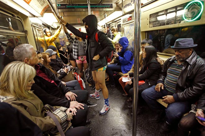 Several men in underwear ride a downtown 6 train in Manhattan during the 15th annual No Pants Subway Ride Sunday in New York. The group event, a prank meant to amuse unsuspecting subway riders, has been going on since 2002. KATHY WILLENS/THE ASSOCIATED PRESS