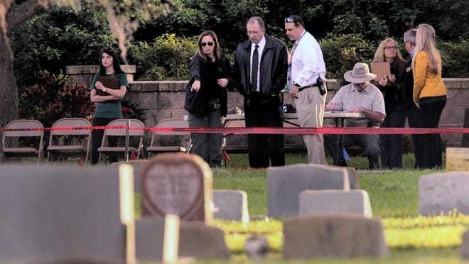 Martin County Sheriff William Snyder, center, looks over the spot investigators will exhume the bodies of three babies Monday morning, January 11, 2016, in hopes of finding out who killed“Baby Moses”. The newborn was found floating in the St. Lucie River behind on Nov. 25, 1983.  An autopsy showed the newborn was alive when he was dumped into the water. (Lannis Waters / The Palm Beach Post)