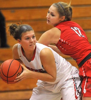 Durfee's Shaelyn Carreiro, looking to pass, gets under Bridgewater-Raynham's Danielle Wabrek during the first half of Tuesday's game. Herald News Photo | Jack Foley