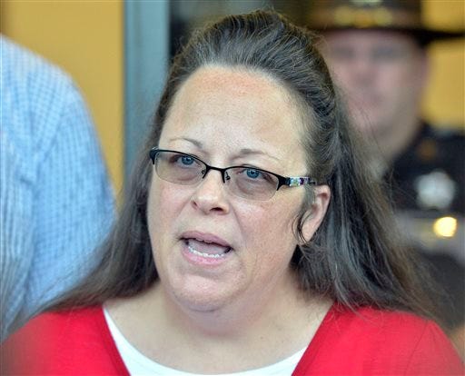 FILE - In this Sept. 14, 2015 file photo, Rowan County Clerk Kim Davis makes a statement to the media at the front door of the Rowan County Judicial Center in Morehead, Kentucky, on Sept. 14, 2015.
