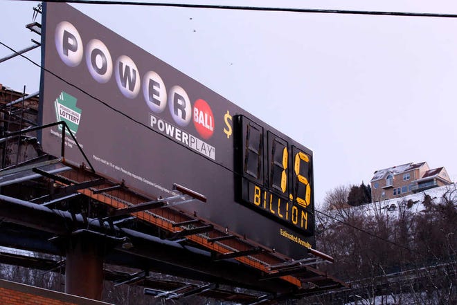 A billboard n downtown Pittsburgh on Tuesday advertises the record $1.5 billion Powerball jackpot.