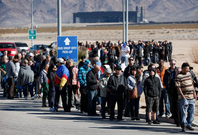 Patrons line up to buy Powerball lottery tickets outside the Primm Valley Casino Resorts Lotto Store just inside the California border Tuesday, Jan. 12, 2016, near Primm, Nev. The Powerball jackpot has grown to over 1 billion dollars for the next drawing on Wednesday. (AP Photo/John Locher)