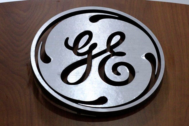 The General Electric logo at a store in Cranberry Township, Pa. General Electric announced today it will move its headquarters from Fairfield, Conn., to the Seaport District of Boston. (AP Photo/Gene J. Puskar, File)