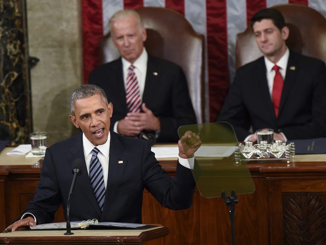 President Barack Obama gestures while giving State of the Union address before a joint session of Congress on Capitol Hill in Washington, Tuesday, Jan. 12, 2016. Vice President Joe Biden and House Speaker Paul Ryan of Wis. listen at rear.