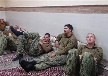 This picture released by the Iranian Revolutionary Guards on Wednesday, Jan. 13, 2016, shows detained American Navy sailors in an undisclosed location in Iran. Iranian state television is reporting that all 10 U.S. sailors detained by Iran after entering its territorial waters have been released. Iran's Revolutionary Guard said the sailors were released Wednesday after it was determined that their entry was not intentional.