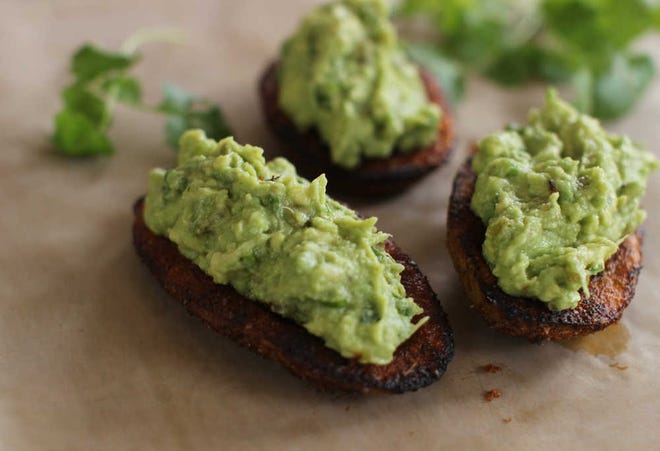 For this easy Super Bowl snack, we combined two of our favorite game day indulgences, guacamole and roasted potato skins.