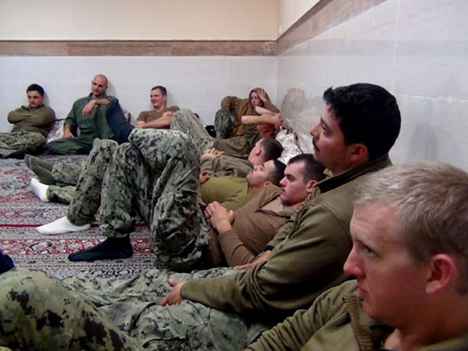 This picture released by the Iranian Revolutionary Guards on Wednesday shows detained American Navy sailors in an undisclosed location in Iran. Iranian state television is reporting that all 10 U.S. sailors detained by Iran after entering its territorial waters have been released. Iran's Revolutionary Guard said the sailors were released Wednesday after it was determined that their entry was not intentional.