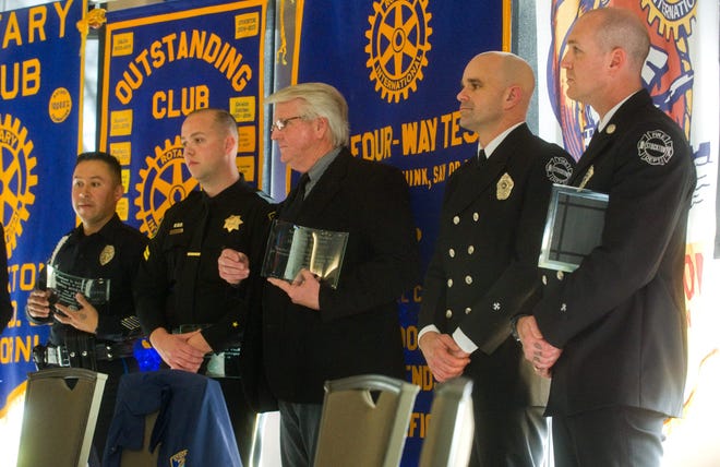 From left, Stockton police Officer Martin Gonzalez, San Joaquin County sheriff's Deputy Andrew Theodore, Lincoln High teacher Jeffery Wright, Stockton firefighter Ian Schneider and fire engineer Nathan Joyce are honored Wednesday during the Stockton Rotary's Vocational Service Awards ceremony at the Stockton Golf & Country Club. CLIFFORD OTO/THE RECORD
