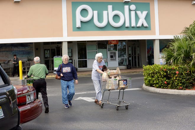 Shoppers leave a Publix Super Market, Thursday, Jan. 14, 2016, in Melbourne Beach, Fla. (AP Photo/John Raoux)