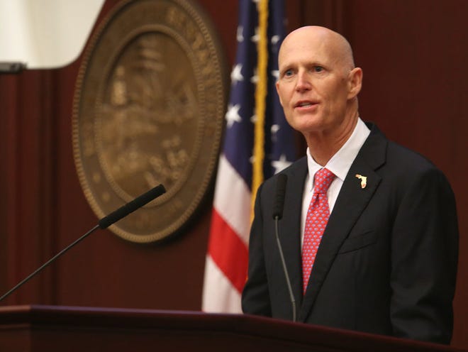 Florida Gov. Rick Scott addresses a joint session of the Florida Legislature during his State of the State address in Tallahassee, Fla., Tuesday, Jan. 12, 2016.