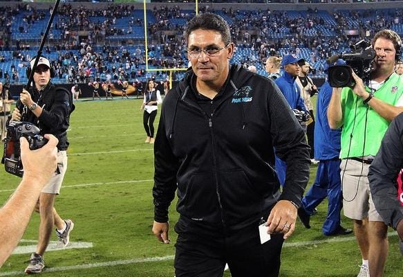 Panthers' head coach Ron Rivera walks off the field after their win against Philadelphia Sunday night at Bank of America Stadium.