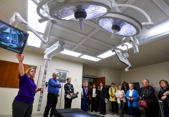 Joy Jirousek, an RN at Advocate Eureka Hospital, gives a tour of an operating room at the hospital's new 28,000 square foot addition at a dedication on Thursday.