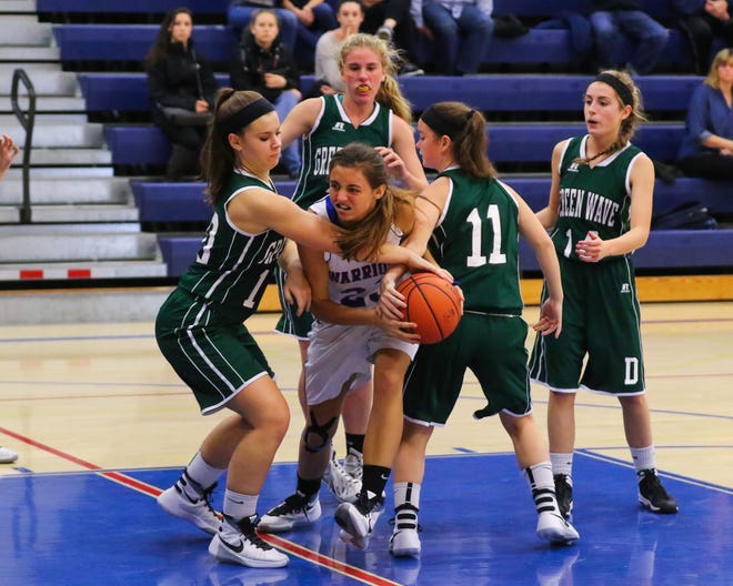 Winnacunnet's Kaya Cadagan, center, returned to action on Tuesday after sitting out two weeks with an ankle injury. She scored a team-high 16 points in Winnacunnet's 64-46 loss to Bedford. Matt Parker file photo/Seacoastonline