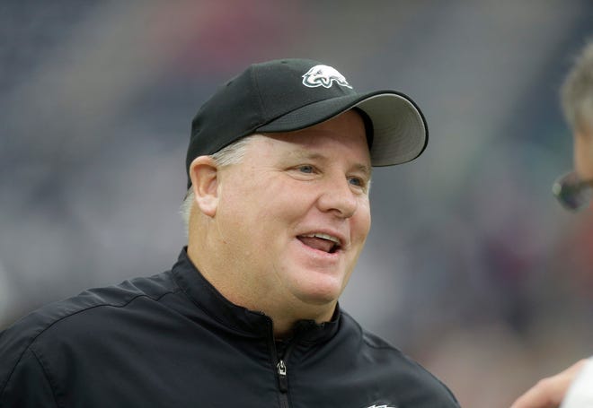 Philadelphia Eagles head coach Chip Kelly watches his team during warm ups on Nov. 2, 2014, before the start of an NFL football game against the Houston Texans. The San Francisco 49ers have hired Chip Kelly as their new head coach. CEO Jed York announced the move on Twitter and so did the team. Patric Schneider/AP