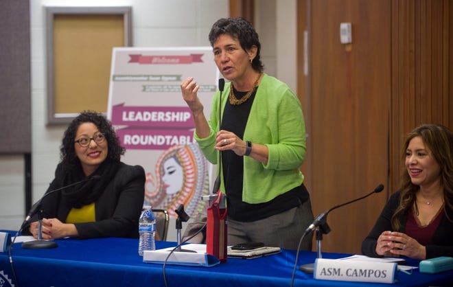 Assemblywoman Susan Talamantes Eggman, center, along with Assemblywomen Cristina Garcia, left, and Nora Campos lead a leadership roundtable Thursday on issues affecting women and girls of color at the Cesar Chavez Central Library in Stockton. CLIFFORD OTO/THE RECORD