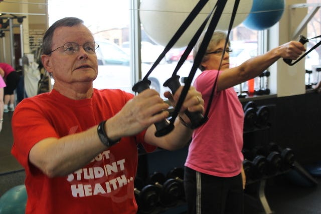 Gerry and Jane Kennedy exercise on the cable machine at the north Ames Racquet and Fitness Center on Wednesday Jan. 13, 2016. 
Photo by Grayson Schmidt/Ames Tribune 
 Gerry and Jane Kennedy stretch before exercising at the north Ames Racquet and Fitness Center on Wednesday Jan. 13, 2016. 
Photo by Grayson Schmidt/Ames Tribune 
 Gerry and Jane Kennedy stretch before exercising at the north Ames Racquet and Fitness Center on Wednesday Jan. 13, 2016. 
Photo by Grayson Schmidt/Ames Tribune