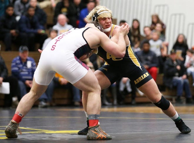 Adrian freshman Angus Arthur (right) wrestles Alma senior Jamie Jakes at 197 Thursday during the first wrestling meet hosted at Adrian College in 31 years. Arthur defeated Jakes, but the Bulldogs fell to the NCAA Division III 13th-ranked scots, 27-11. Telegram photo by Mike Dickie
