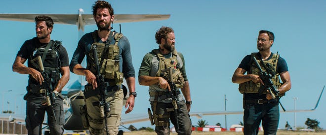 In this photo provided by Paramount Pictures shows Pablo Schreiber, from left, as Kris "Tanto" Paronto, John Krasinski as Jack Silva, David Denman as Dave "Boon" Benton and Dominic Fumusa as John "Tig" Tiegen, in the film, "13 Hours: The Secret Soldiers of Benghazi" from Paramount Pictures and 3 Arts Entertainment/Bay Films. The movie releases in U.S. theaters Jan. 15, 2016. (Christian Black/Paramount Pictures via AP)