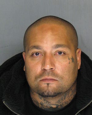Homicide and carjacking suspect Ernesto Velazquez, 40, is a documented gang member who should be considered armed and dangerous. Anyone who sees Velazquez should call 911 immediately, police say. COURTESY STOCKTON POLICE DEPARTMENT