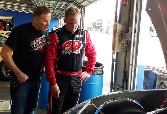Mike Wallace, who has three wins at Daytona, talks with his 20-year-old son Matt during Saturday's ARCA test at the Speedway. NEWS-JOURNAL/GODWIN KELLY