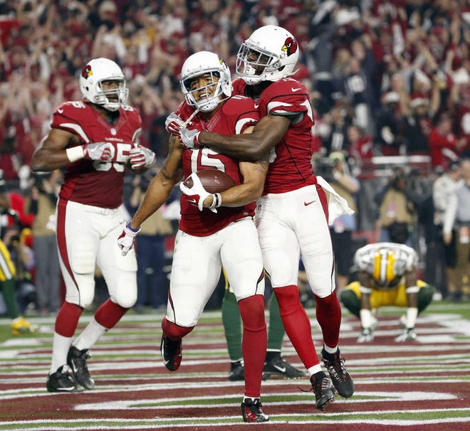 Arizona Cardinals wide receiver Michael Floyd (15) celebrates his touchdown catch with Jaron Brown (13) against the Green Bay Packers during the second half of an NFL divisional playoff football game, Saturday, Jan. 16, 2016, in Glendale, Ariz. (Michael Chow/The Arizona Republic via AP) MARICOPA COUNTY OUT; MAGS OUT; NO SALES; MANDATORY CREDIT