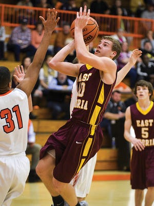 Ian Misteadt of East Peoria drives to the basket during Friday's game against Mahomet.