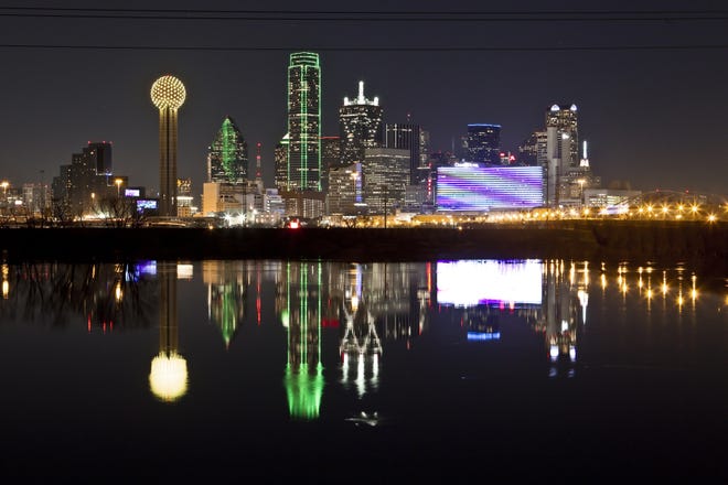 The Dallas skyline reflected in the Trinity River. Dallas has boomed in recent years as Texas has experienced solid job growth and outpaced the nation's economic growth since the recession. AP/files