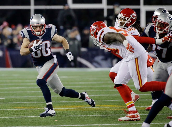 New England Patriots wide receiver Danny Amendola (80) runs from Kansas City Chiefs linebacker Dezman Moses (54) in the second half of an NFL divisional playoff football game, Saturday, Jan. 16, 2016, in Foxborough, Mass.
