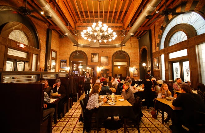 Patrons enjoy dinner Friday evening inside 301 Bistro. The building maintains the look and feel of a train station, its original function. The new restaurant is in the old L&N station on Greensboro Ave. in Tuscaloosa. Staff Photo | Gary Cosby Jr.
