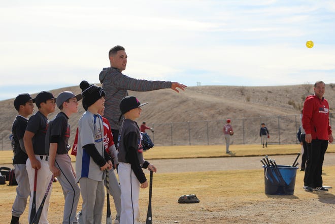 Blue Jay pitcher and Barstow High graduate Aaron Sanchez pitches to a young player at the fifth annual Dino Ebel Baseball Clinic in Barstow on Saturday. (Jeff Cooper, Daily Press)