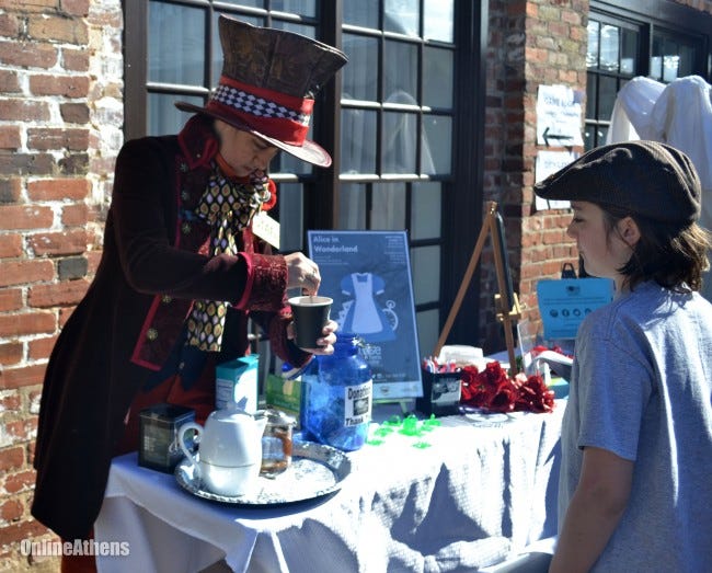 Audey Lee, dressed as the Mad Hatter from "Alice in Wonderland," makes tea for visitors at AthCon on Sunday, Jan. 17, 2015 in Athens, Ga. (Hilary Butschek/Staff, @hilarylbutschek)