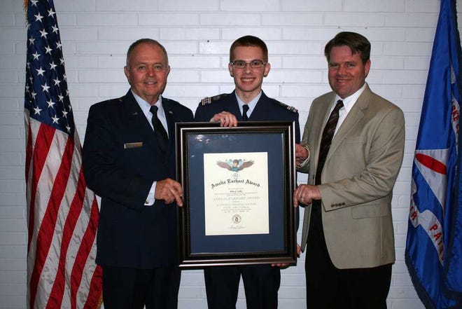 C/Captain Alan G. Corley for his receiving the coveted Amelia Earhart award. The award was presented by his very proud grandfather, USAF Brig. Gen. (retired) Robert ?ob?L. Corley. Officiating the ceremony was Lt. Col. James Crone, Group 2 Commander and 1st Lt. Craig Boozer, 452 Squadron Cadet Commander