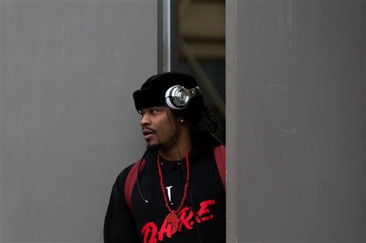 Seattle Seahawks running back Marshawn Lynch leaves the Virginia Mason Athletic Center to board a bus to travel to the team's NFL football game Sunday against the Carolina Panthers, Friday, Jan. 15, 2016, in Seattle. (Grant Hindsley/seattlepi.com via AP) MAGAZINES OUT; NO SALES; SEATTLE TIMES OUT; TV OUT; MANDATORY CREDIT