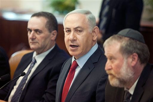 Israeli Prime Minister Benjamin Netanyahu, center, attends a weekly cabinet meeting in Jerusalem. Sunday, Jan. 17, 2016. (Dan Balilty/Pool photo via AP)