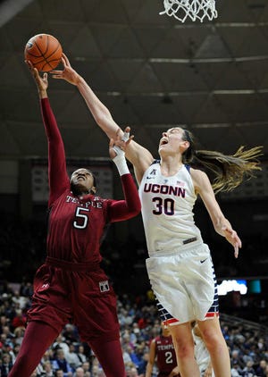 Connecticut's Breanna Stewart (30) blocks a shot-attempt by Temple's Ugo Nwaigwe (5) in the first half of an NCAA college basketball game, Saturday, Jan. 16, 2016, in Storrs, Conn. (AP Photo/Jessica Hill)