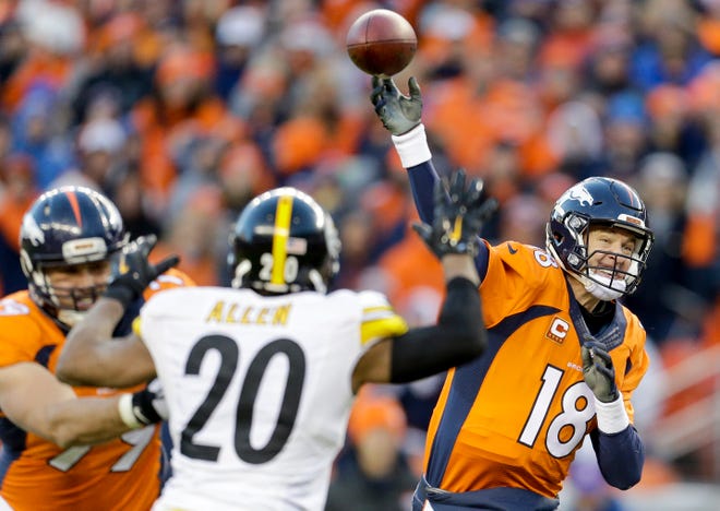 Denver Broncos quarterback Peyton Manning, right, passes against the Pittsburgh Steelers during the second half on Sunday in Denver.