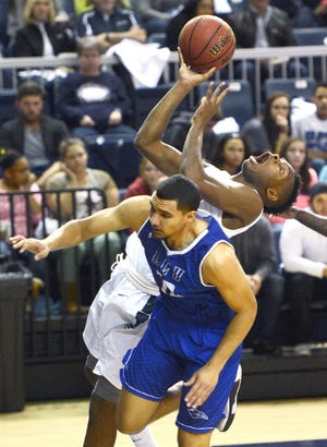 BRIAN D. SANDERFORD • TIMES RECORD UAFS’ DaVaunta Thomas, back, is fouled by Lubbock Christian’s Matthew Alford as he shoots in the first quarter on Saturday, Jan. 16, 2016 in the Stubblefield Center. 
 BRIAN D. SANDERFORD • TIMES RECORD UAFS’ Dusan Stojanovic, left, goes to the basket over Lubbock Christian’s Isaac Cardona during the first quarter on Saturday, Jan. 16, 2016 in the Stubblefield Center. 
 BRIAN D. SANDERFORD • TIMES RECORD UAFS’ Alex Cooper shoots a 3 over Lubbock Christian’s Marcos Schuster on Saturday, Jan. 16, 2016 in the Stubblefield Center. The Lions won the game 84-74. 
 BRIAN D. SANDERFORD • TIMES RECORD UAFS’ Skai Thompson is fouled from the back by Lubbock Christian’s Kellyn Schneider as she goes by Haley Fowler, right, on Saturday, Jan. 16, 2016 in the Stubblefield Center. 
 BRIAN D. SANDERFORD • TIMES RECORD UAFS’ Andrea Wilson, right, guards Lubbock Christian’s Nicole Hampton during the second quarter on Saturday, Jan. 16, 2016 in the Stubblefield Center.