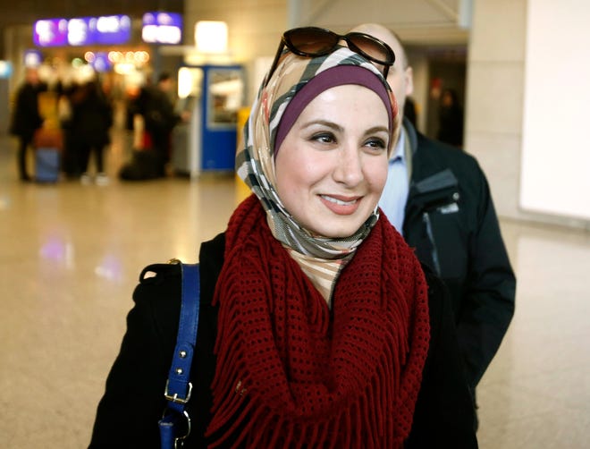 Sarah Hekmati, sister of Amir Hekmati, smiles as she arrives at the airport in Frankfurt, Germany, Monday, Jan. 18, 2016, the day after former US marine Amir Hekmati landed safely in Geneva and was transferred to Germany after being released from prison in Iran on Saturday. (AP Photo/Michael Probst)