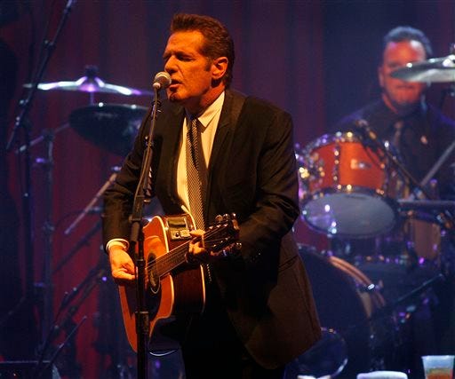 FILE - In this March 20, 2010 file photo, Glenn Frey of the Eagles performs at Muhammad Ali's Celebrity Fight Night XVI in Phoenix, Arizona. The Eagles said band founder Frey died Monday, Jan. 18, 2016, in New York after battling multiple ailments. He was 67.