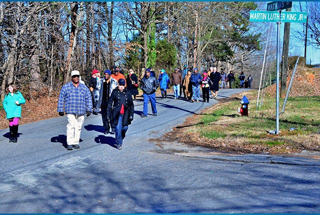 CHILLY WALK — A small group of people braved the cold Monday morning for the annual march following the annual Martin Luther King Jr. Day breakfast at Central Gym in Asheboro. (Ricky Ingold/The Courier-Tribune) 
 Early morning breakfast held at the Central Gym for the Martin Luther King Jr. Day Celebration. 
 Keynote Speaker Dr. Dannellia Gladden-Green
