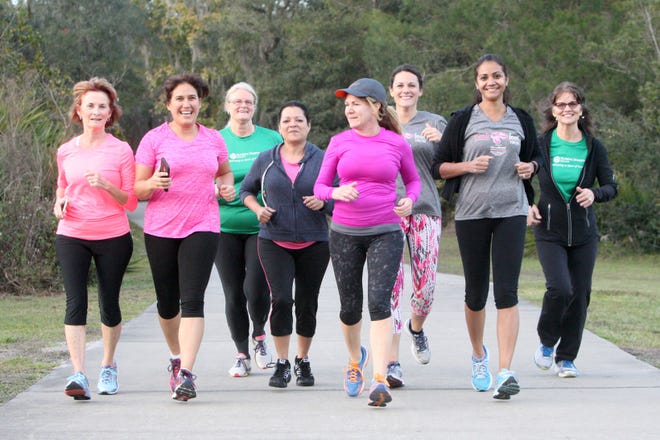Christine Miller, third from right, a physical therapy assistant and a health and wellness coach for Florida Hospital DeLand, and Lita Kapuscinski, second from right, a physical therapist and rehabilitation services director also for Florida Hospital DeLand, participate in a training session at Lake Beresford in DeLand recently for the Me Strong 5K. The pair set up a 12-week program to help the group train for the foot race that takes place this Saturday. Training with friends or in a group can “make the time and miles fly by faster,” noted Marcus Droker, a personal trainer and director of Halifax Health’s corporate wellness program.
News-Journal / LOLA GOMEZ
